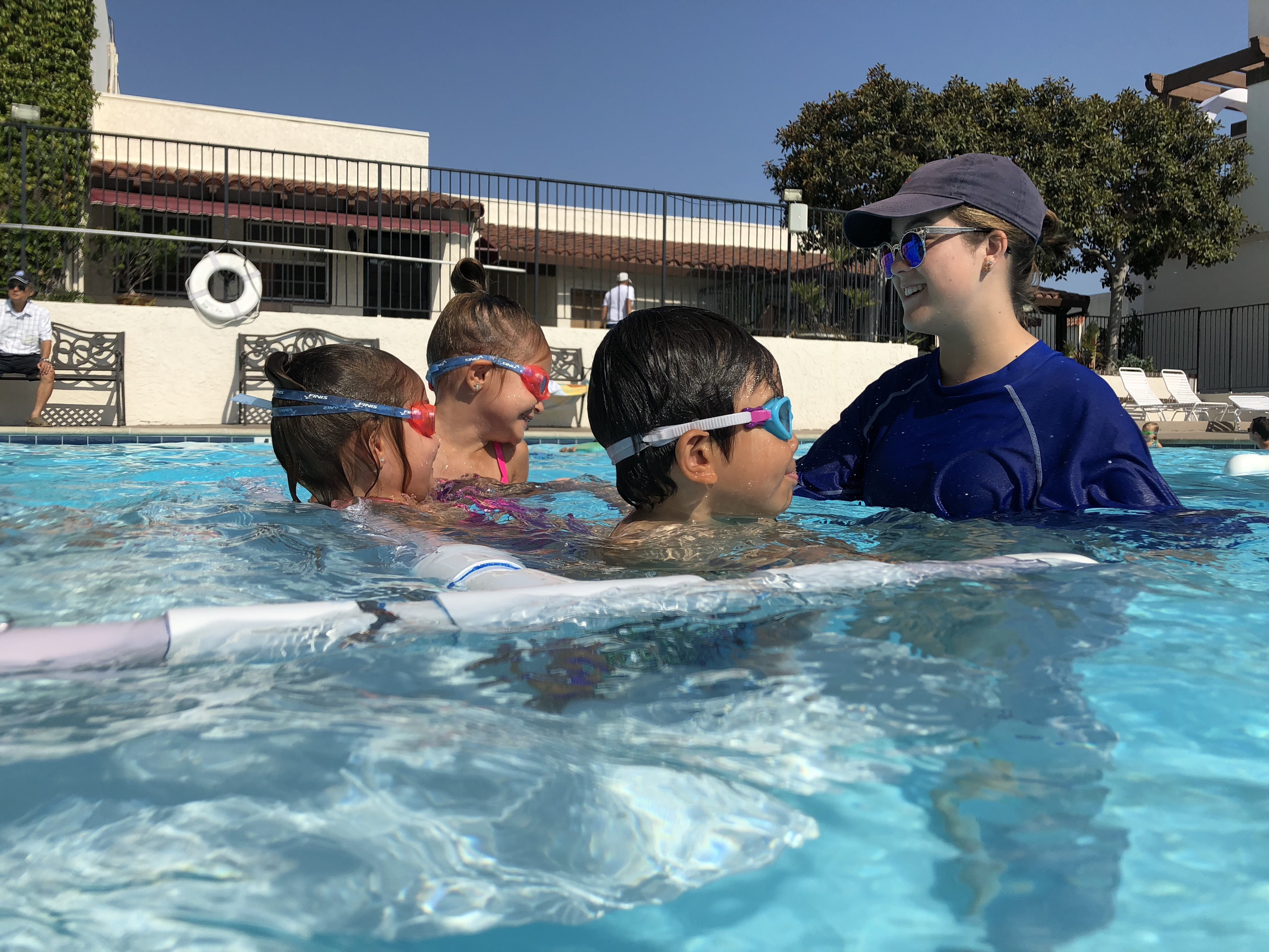 Group of students and instructor during a swimming lesson at Nova Swim School