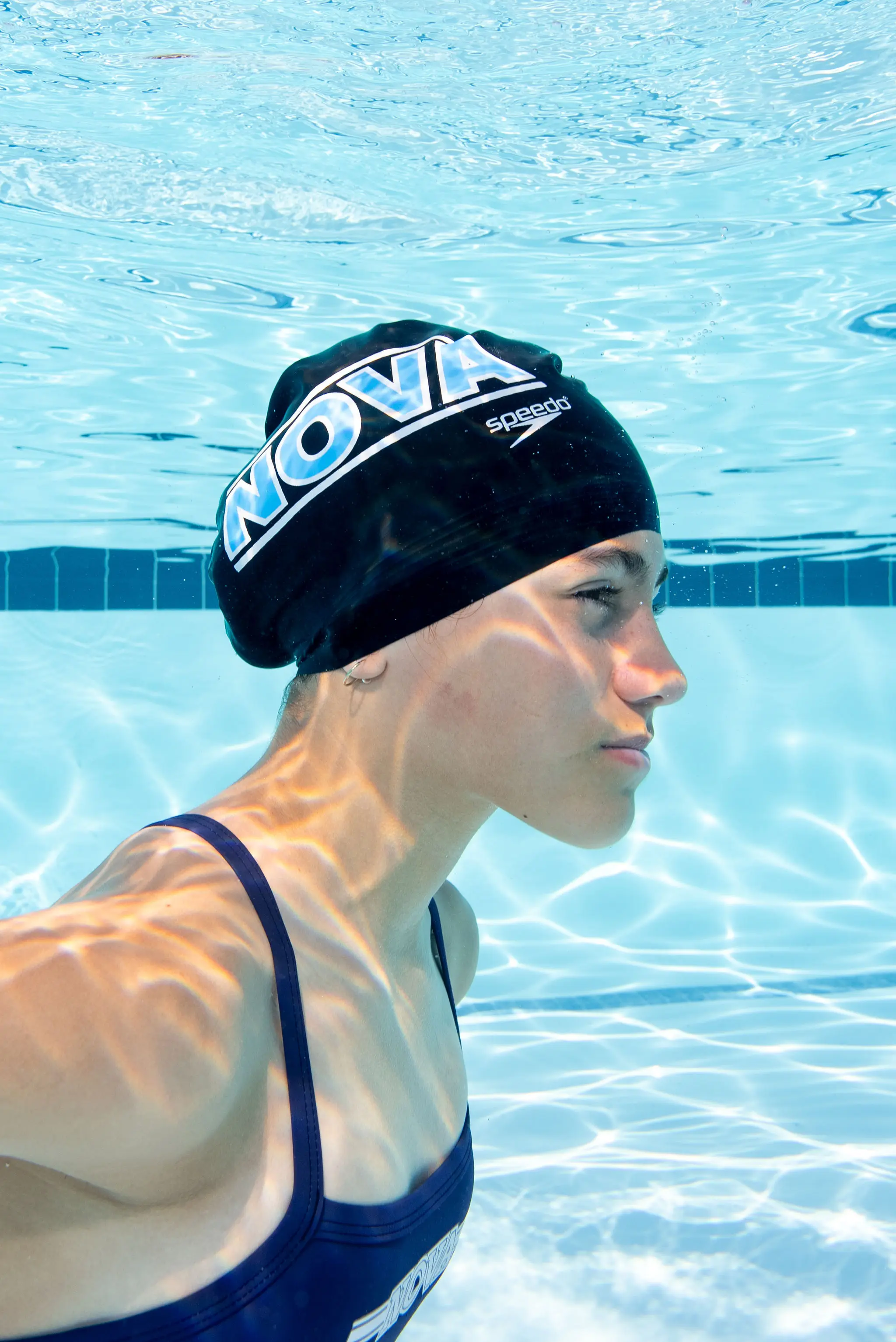 Vivienne-35 Young swimmer practicing strokes in the pool during a Nova Swim School lesson